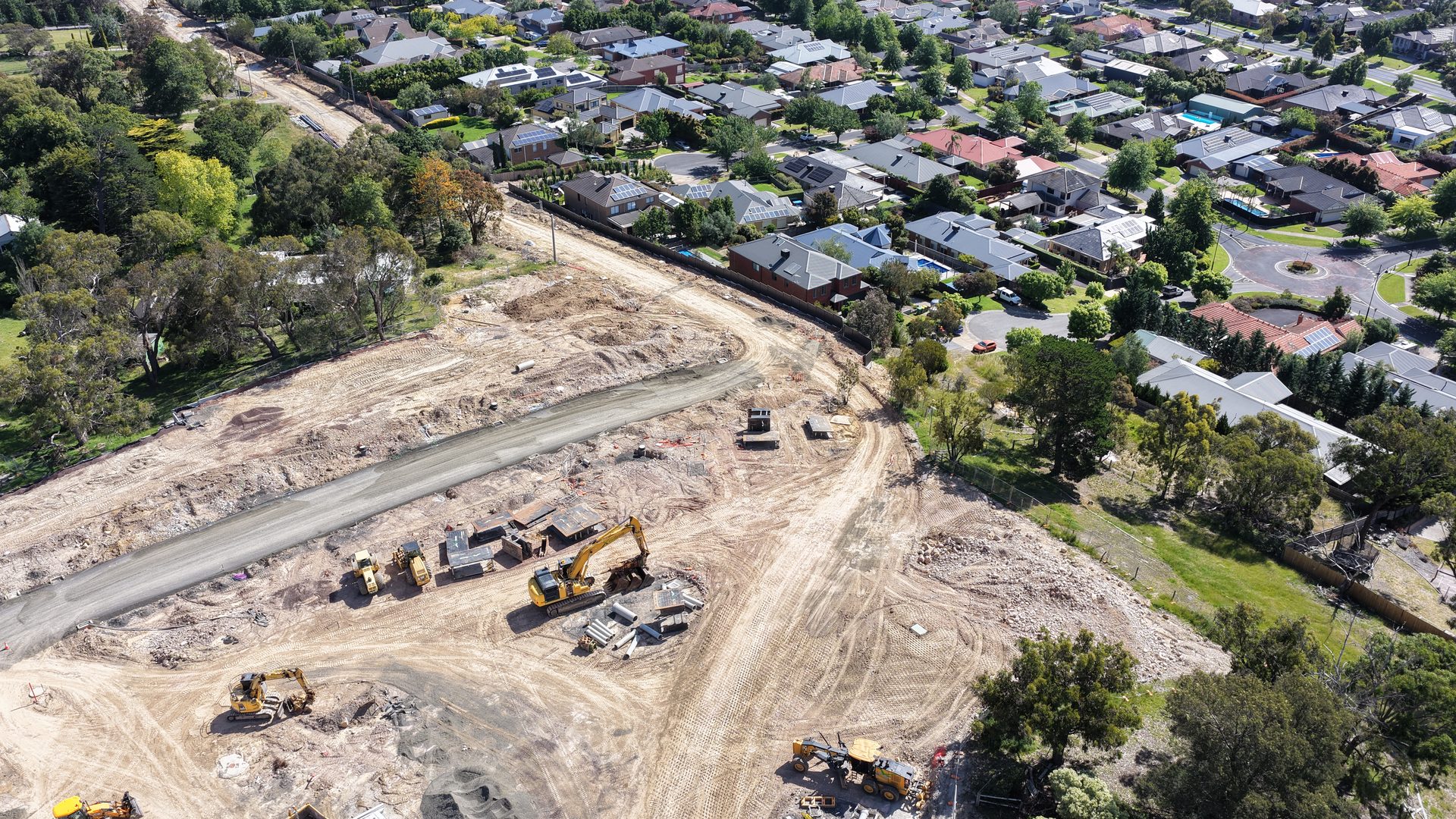 May Road excavators and residential area